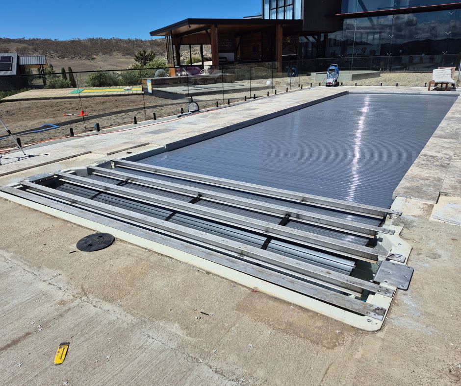 Hard pool cover in progress of installation