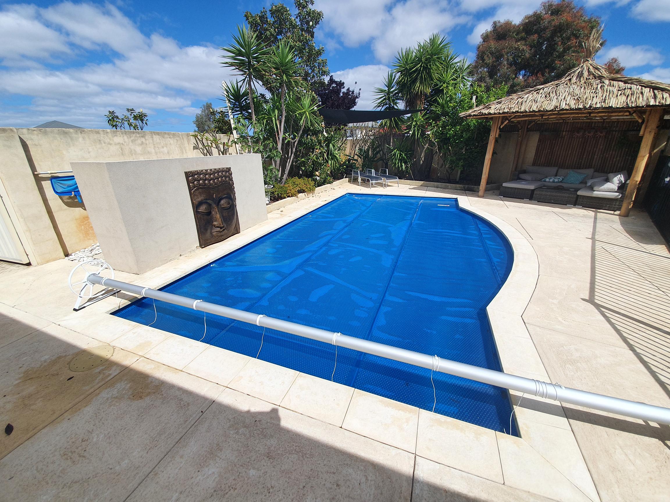   An A75 Roller with a Balinese style backyard setting.