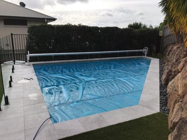 Roller installed along the length of the pool due to odd shape.