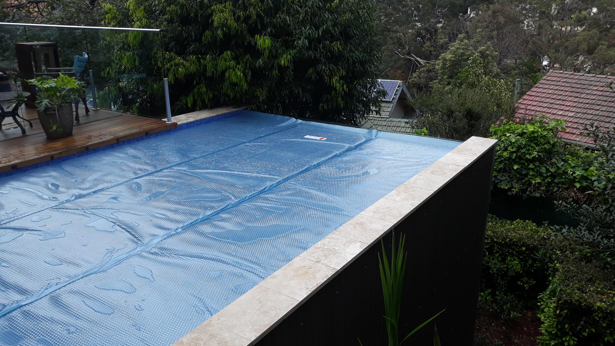 A stunning view for this infinity edge pool, with the cover going right up to the edge.